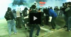 Oakland Policeman Throws Flash Grenade Into Crowd Trying To Help Injured Protester 